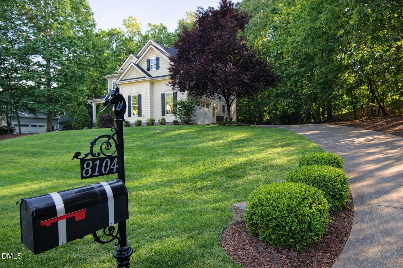 8104 Henderson Road Apex, NC 27539 - Photo 2 of 45 a front view of a house with garden