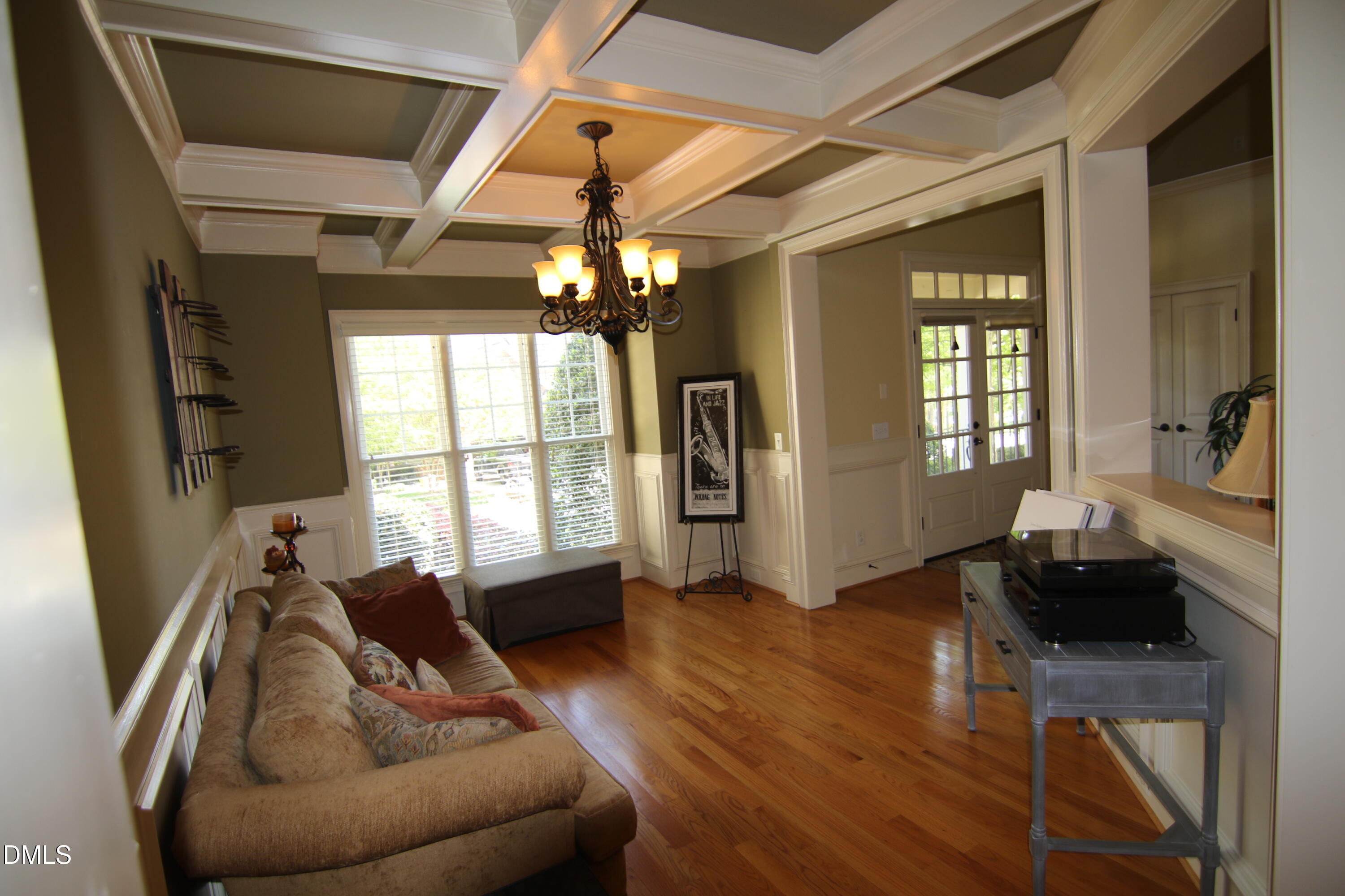 8104 Henderson Road Apex, NC 27539 - Photo 19 of 45 a living room with furniture and a wooden floor