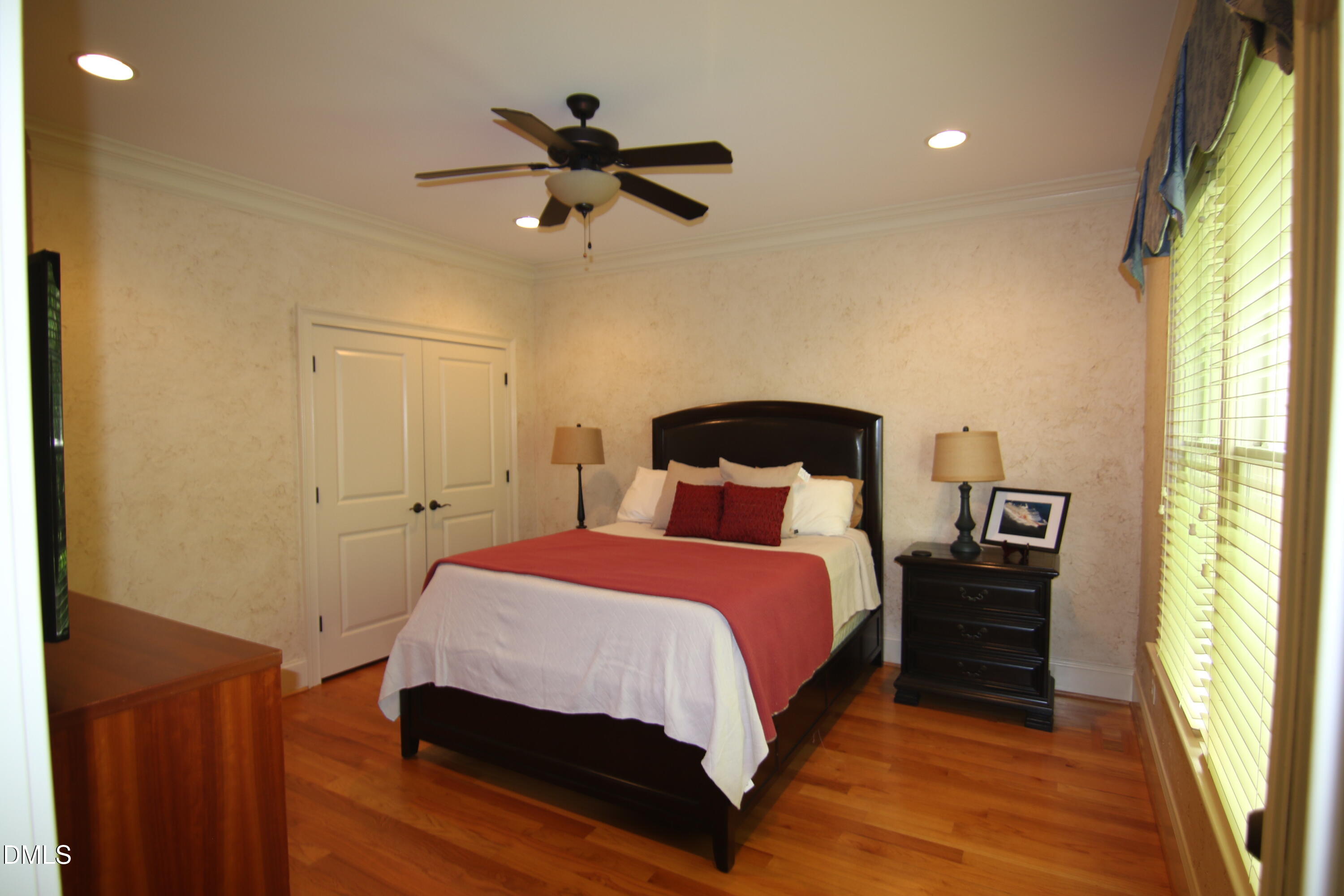8104 Henderson Road Apex, NC 27539 - Photo 21 of 45 a bedroom with a bed and a window