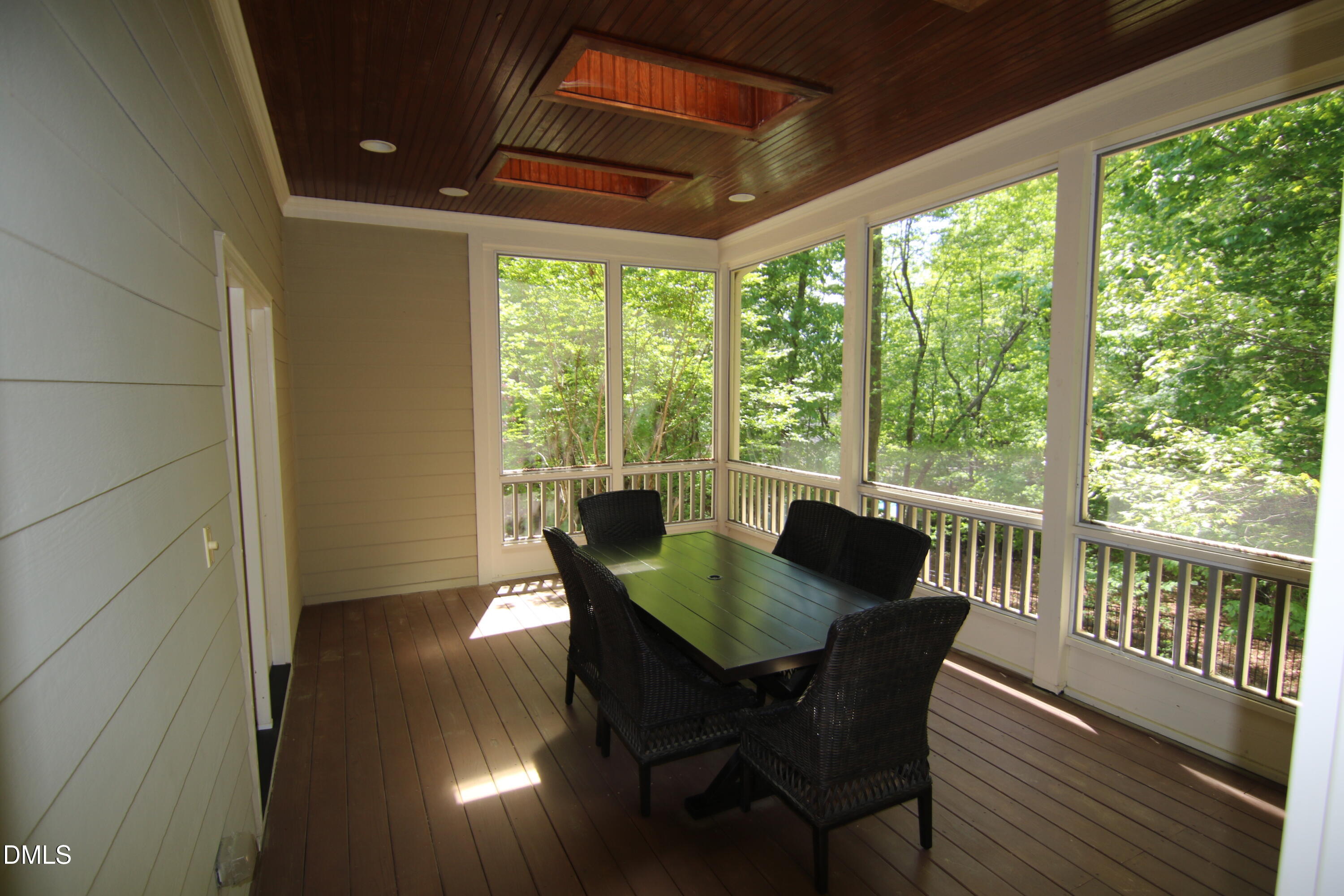 8104 Henderson Road Apex, NC 27539 - Photo 25 of 45 a view of a dining room with furniture window and wooden floor