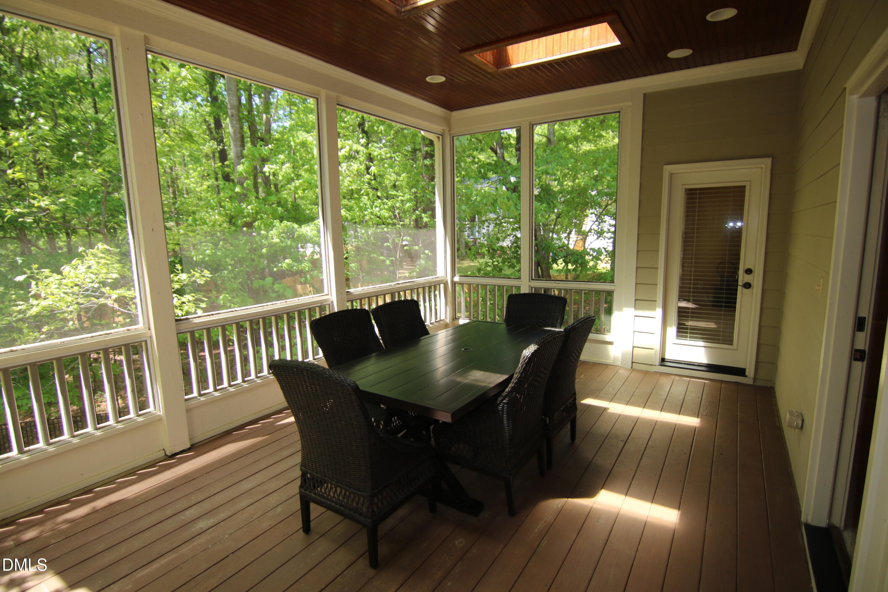 8104 Henderson Road Apex, NC 27539 - Photo 26 of 45 a view of a dining room with furniture window and outside view