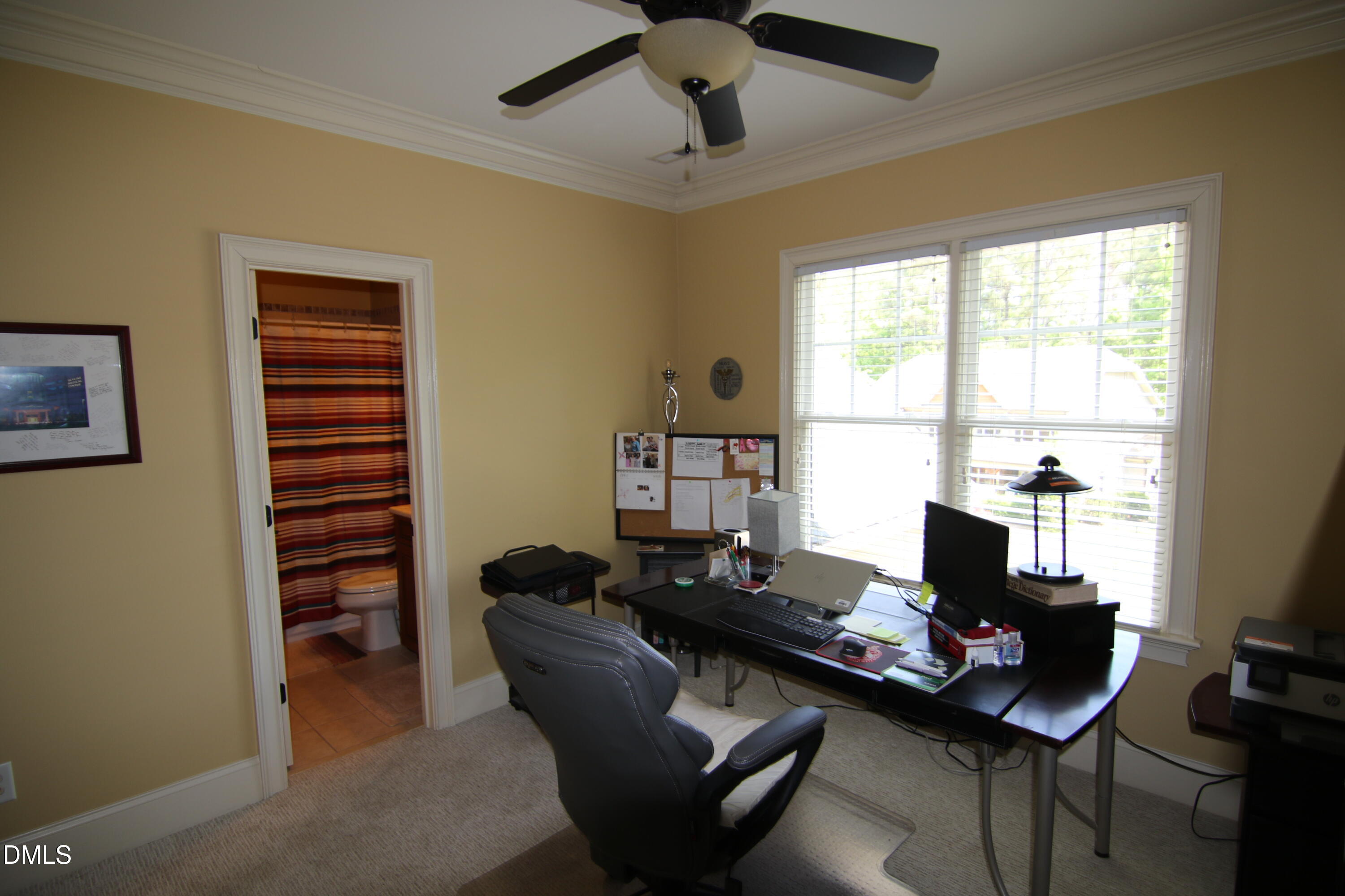 8104 Henderson Road Apex, NC 27539 - Photo 32 of 45 a living room with furniture and a window