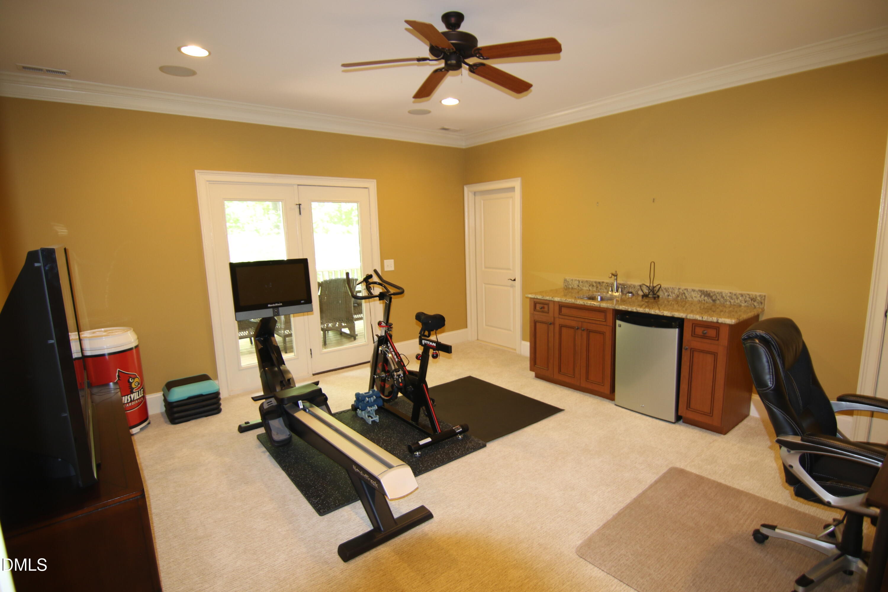 8104 Henderson Road Apex, NC 27539 - Photo 34 of 45 a view of a workspace with furniture and a window