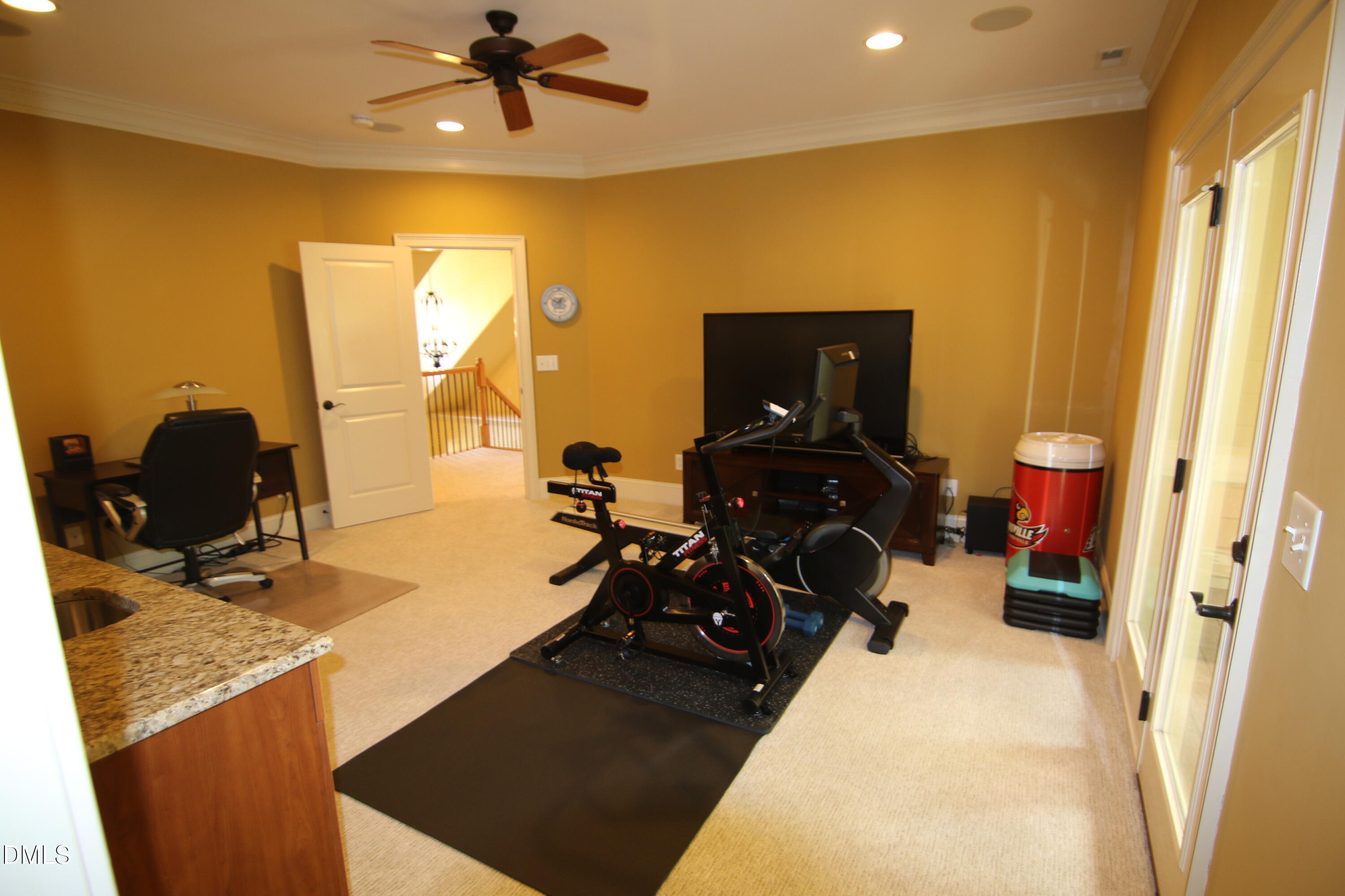 8104 Henderson Road Apex, NC 27539 - Photo 35 of 45 a bed room with a bed and a computer