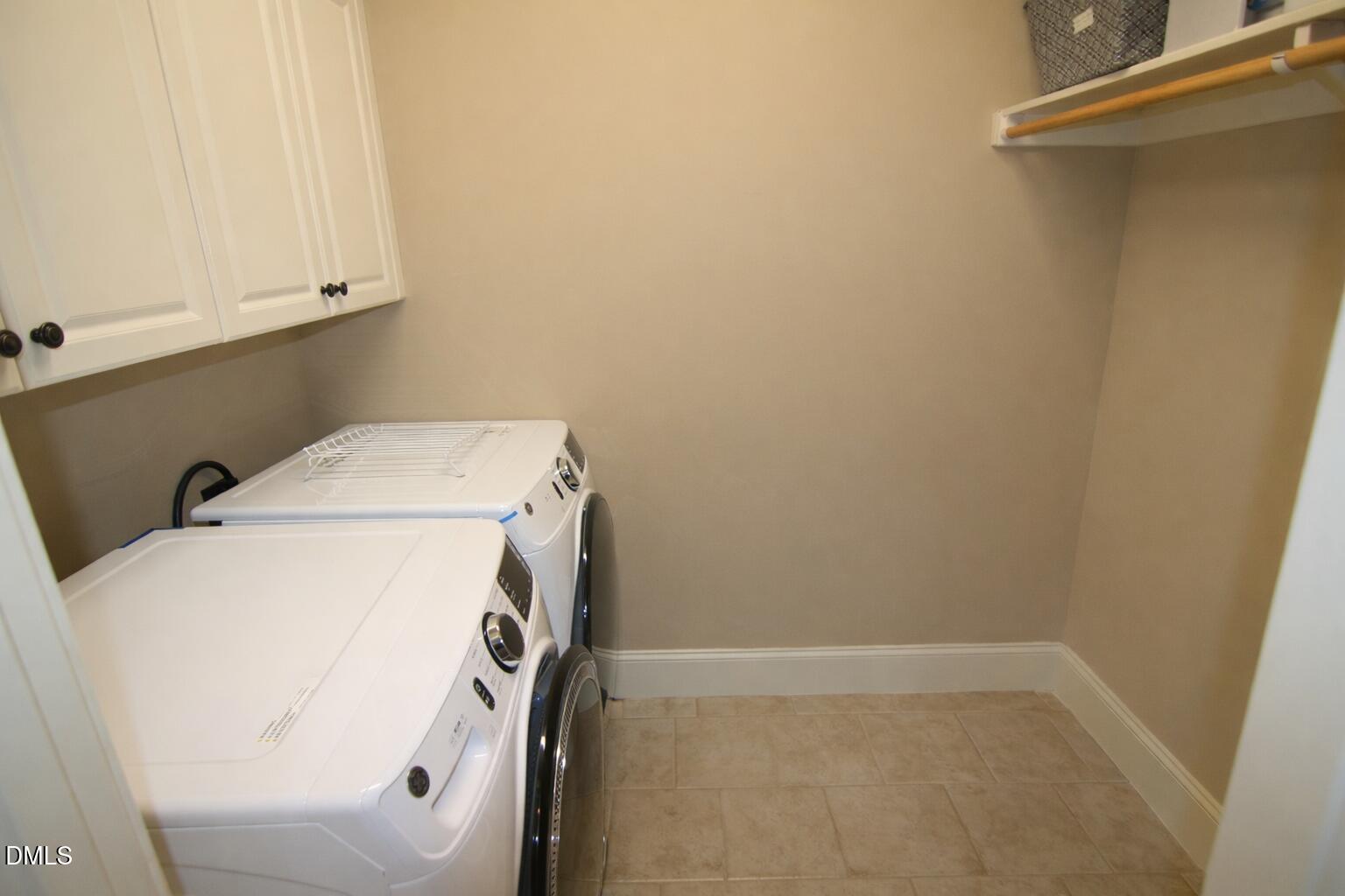 8104 Henderson Road Apex, NC 27539 - Photo 39 of 45 a utility room with dryer and washer