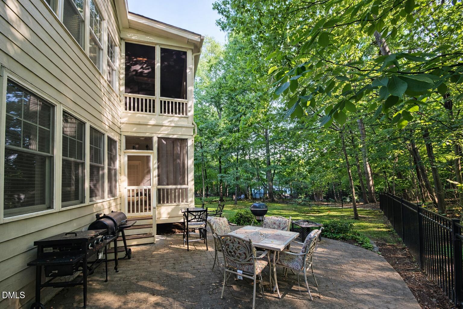 8104 Henderson Road Apex, NC 27539 - Photo 5 of 45 a view of a house with backyard porch and sitting area