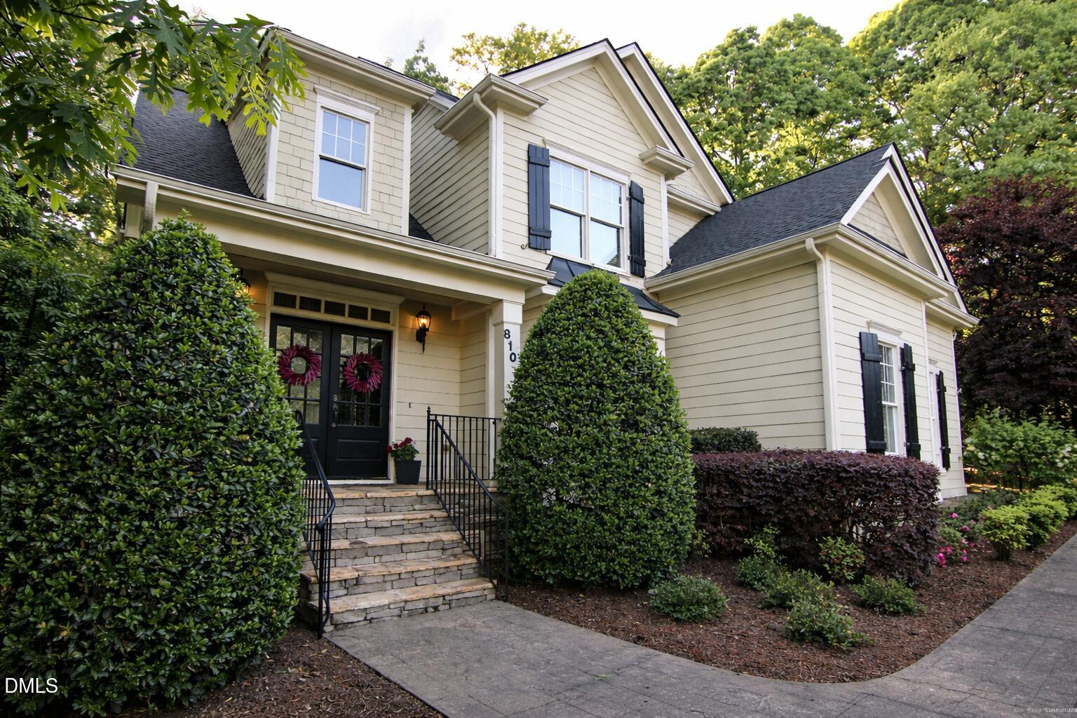8104 Henderson Road Apex, NC 27539 - Photo 6 of 45 a view of a house with potted plants