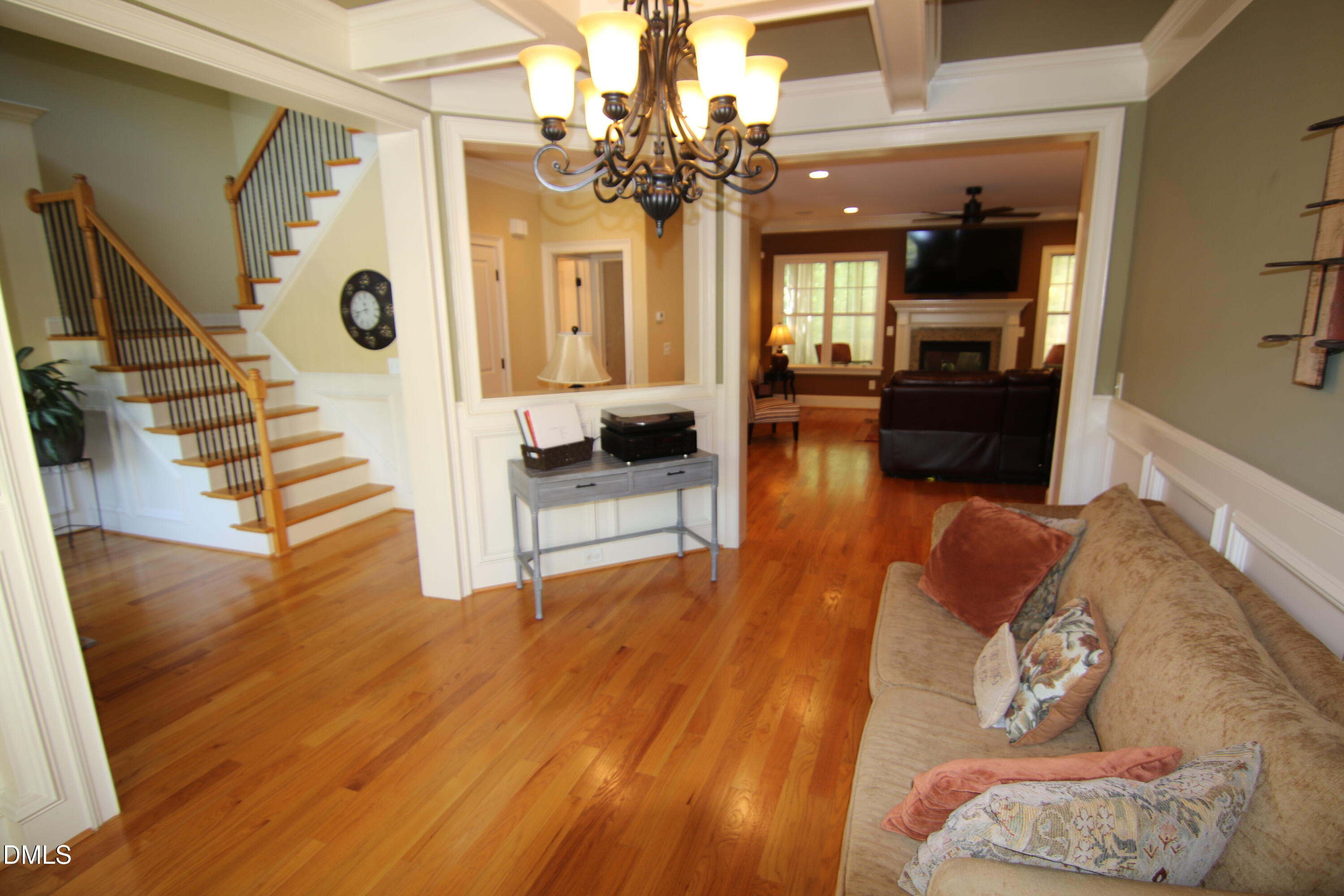 8104 Henderson Road Apex, NC 27539 - Photo 8 of 45 a living room with furniture and wooden floor