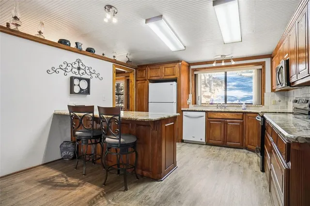 a view of a kitchen and dining area