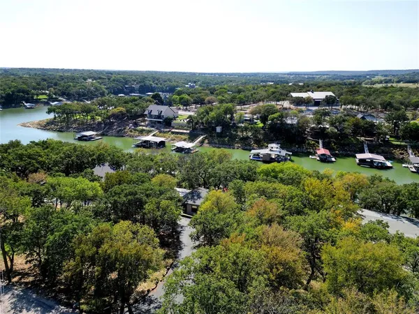 an aerial view of a house with a lake view