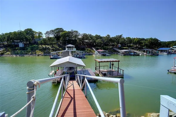 swimming pool view with a lake view