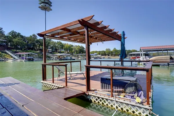 a patio with water view fountain and a table