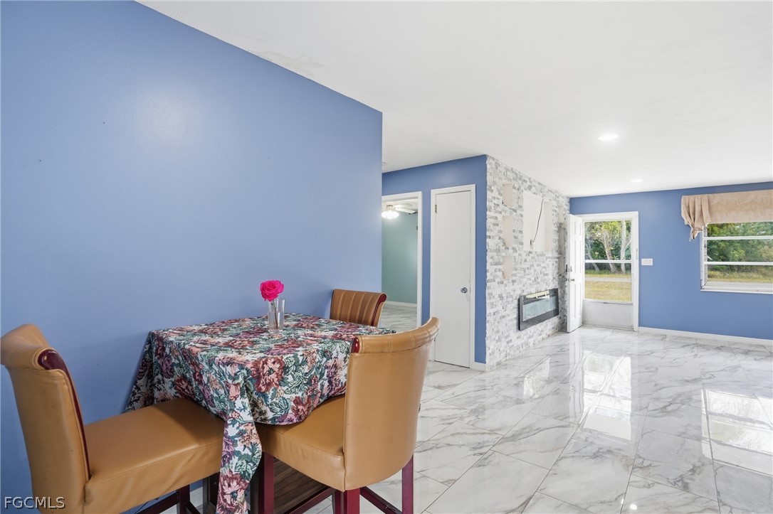 2180 Cook Lane Alva, FL 33920 - Photo 11 of 46 a dining room with furniture and window