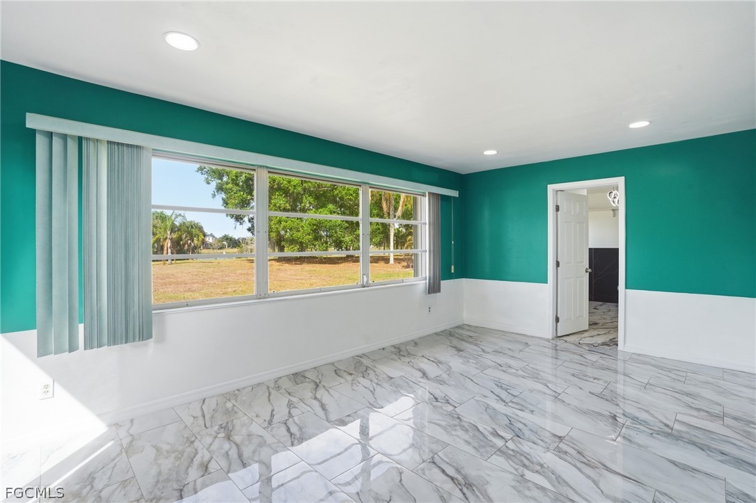 2180 Cook Lane Alva, FL 33920 - Photo 18 of 46 a view of an empty room with a window