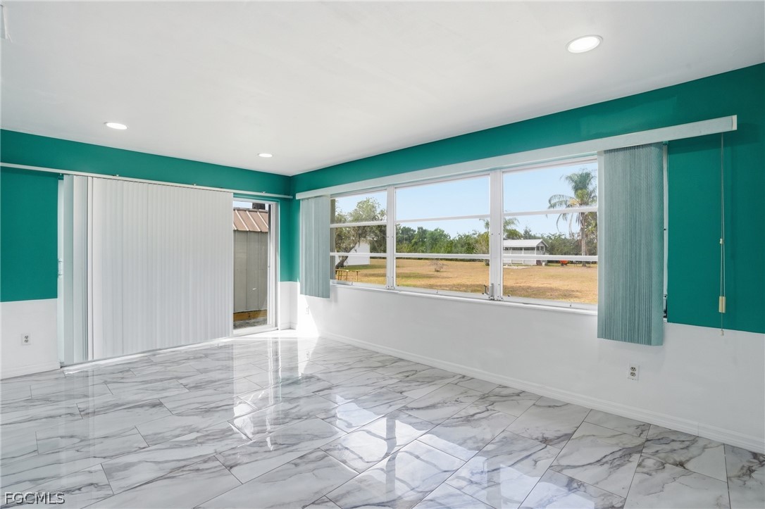 2180 Cook Lane Alva, FL 33920 - Photo 19 of 46 a view of an empty room with a window