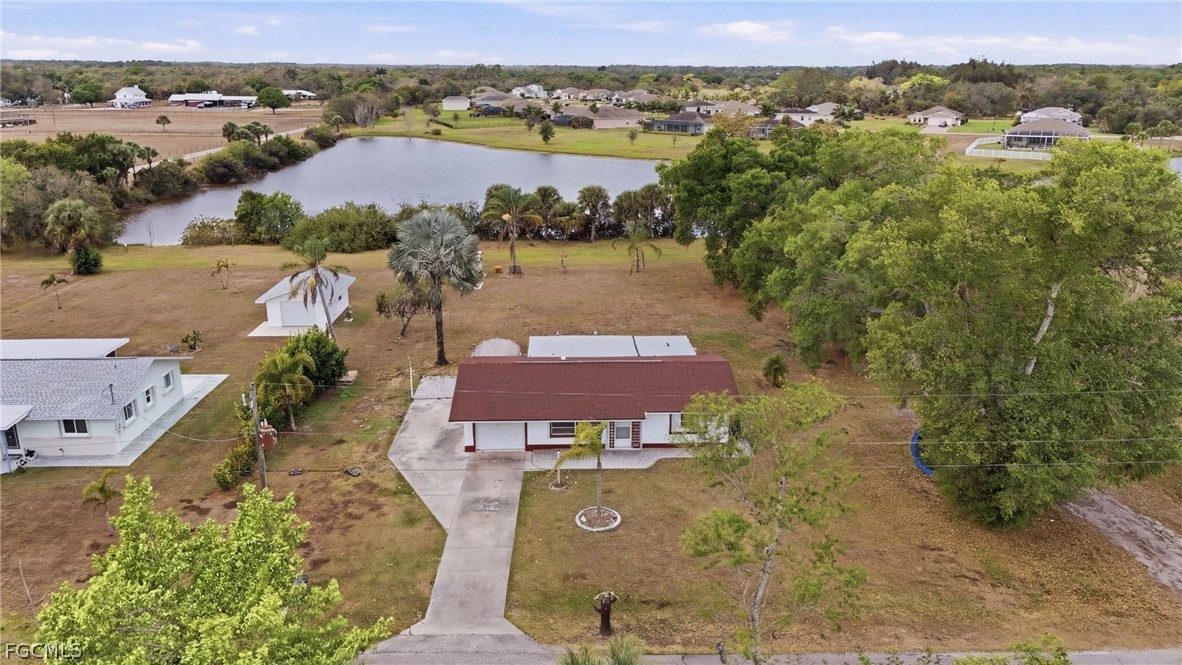 2180 Cook Lane Alva, FL 33920 - Photo 2 of 46 an aerial view of a house with a lake view