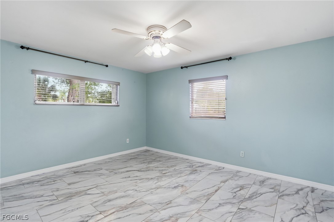 2180 Cook Lane Alva, FL 33920 - Photo 24 of 46 a view of room with window and ceiling fan