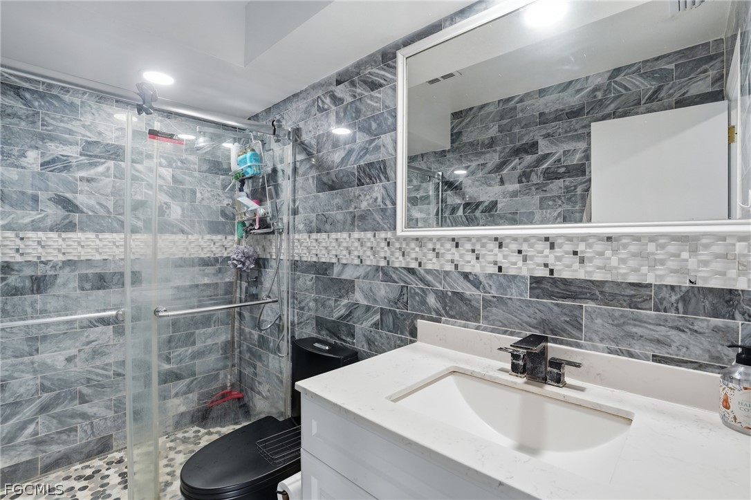 2180 Cook Lane Alva, FL 33920 - Photo 25 of 46 a bathroom with a sink and a mirror