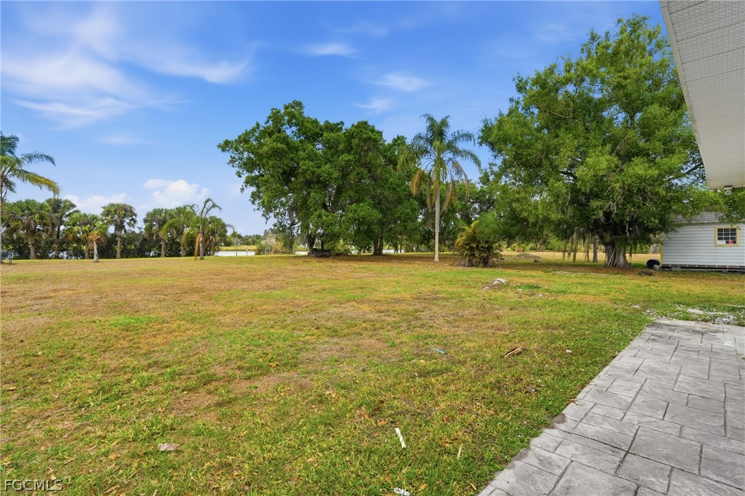 2180 Cook Lane Alva, FL 33920 - Photo 35 of 46 a view of yard with swimming pool and green space