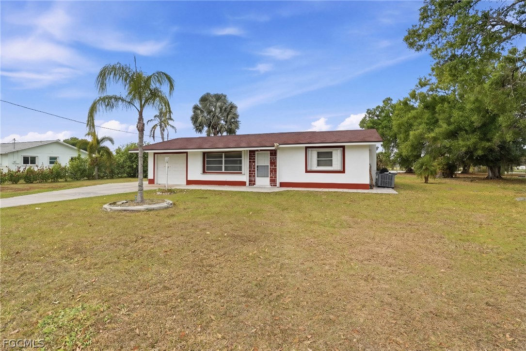 2180 Cook Lane Alva, FL 33920 - Photo 4 of 46 a view of a house with swimming pool and a yard