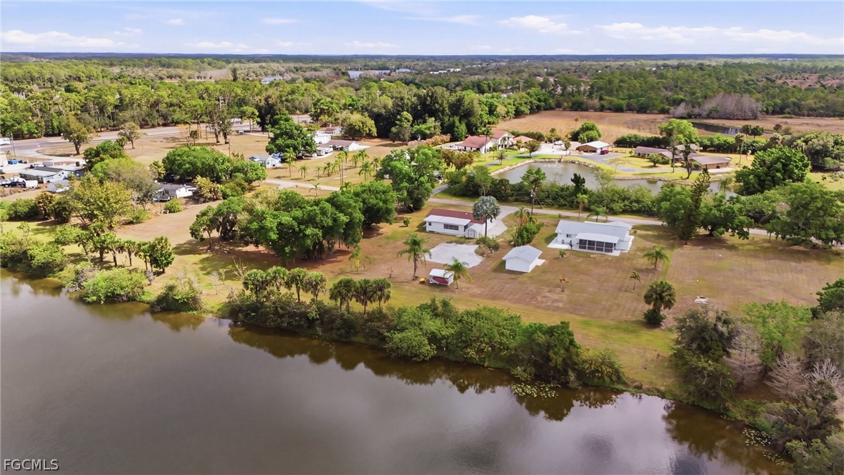 2180 Cook Lane Alva, FL 33920 - Photo 43 of 46 a view of a lake with houses