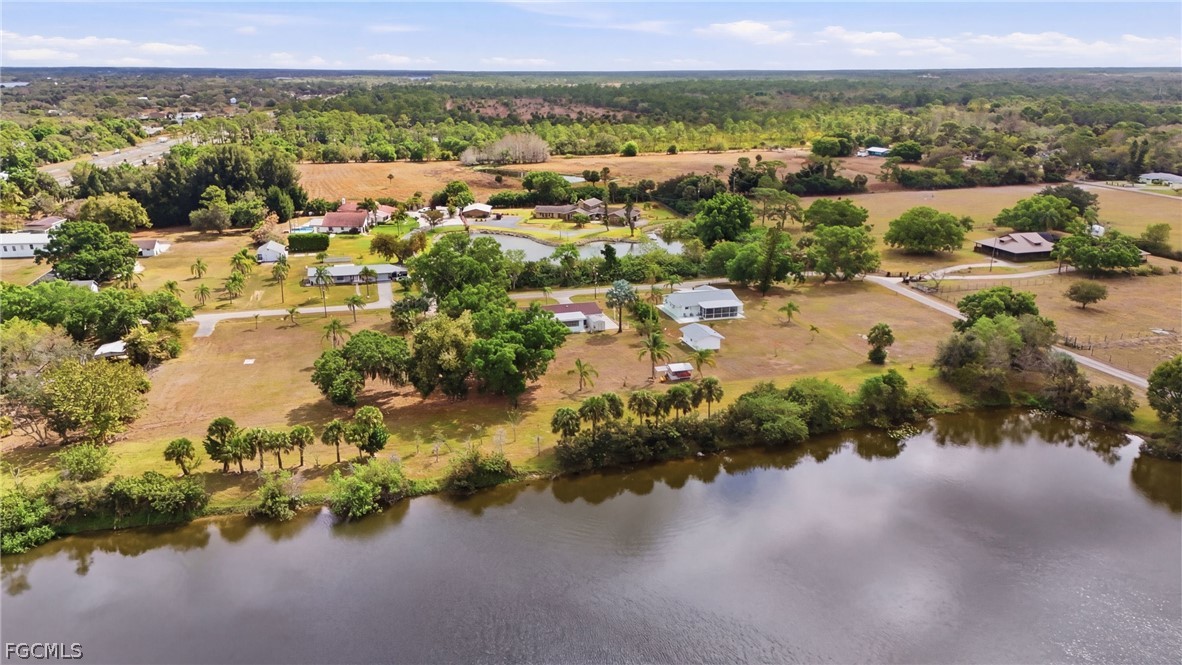 2180 Cook Lane Alva, FL 33920 - Photo 44 of 46 an aerial view of a houses with a lake view