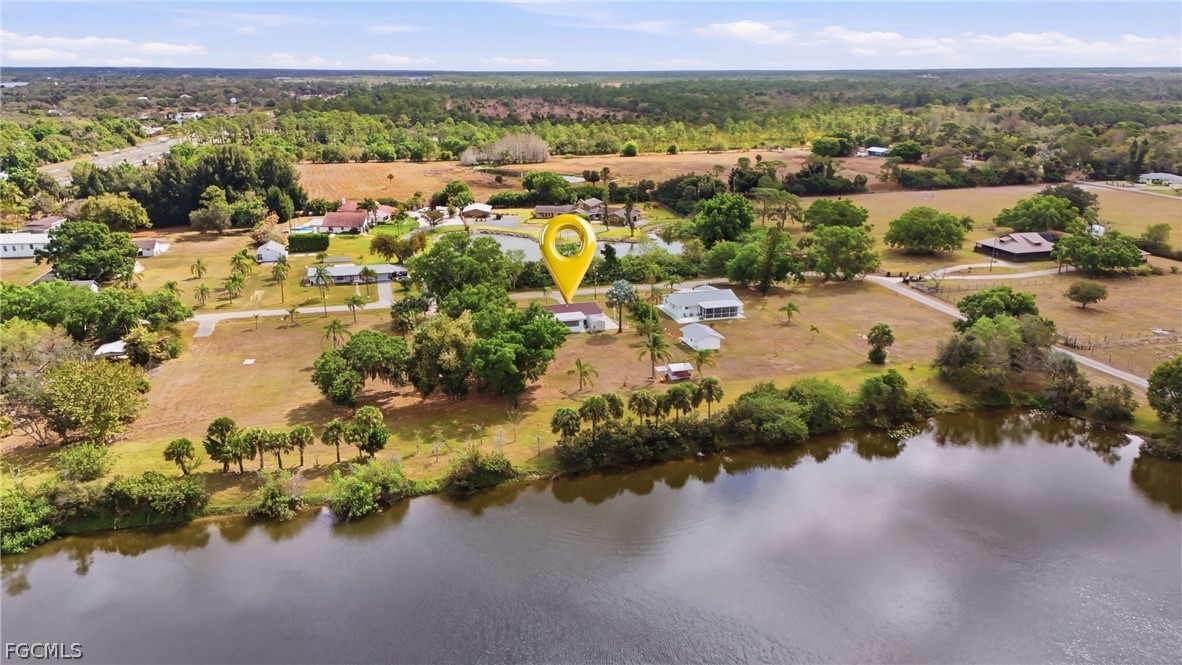 2180 Cook Lane Alva, FL 33920 - Photo 45 of 46 an aerial view of a houses with a lake view