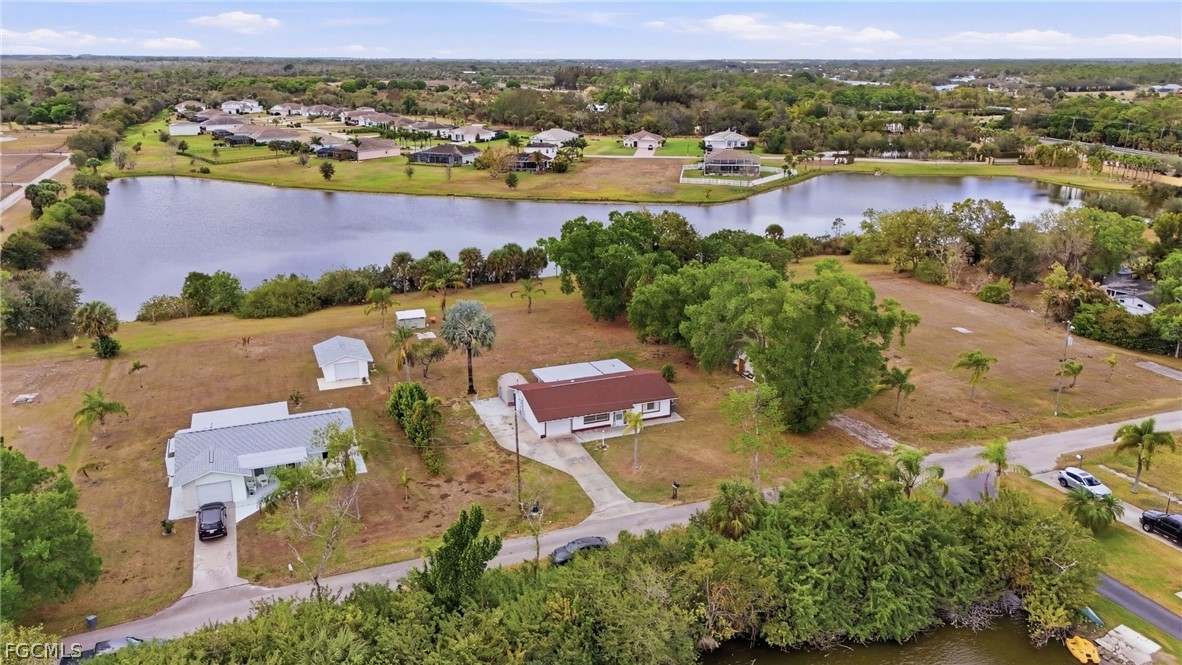2180 Cook Lane Alva, FL 33920 - Photo 6 of 46 an aerial view of residential houses with outdoor space and river