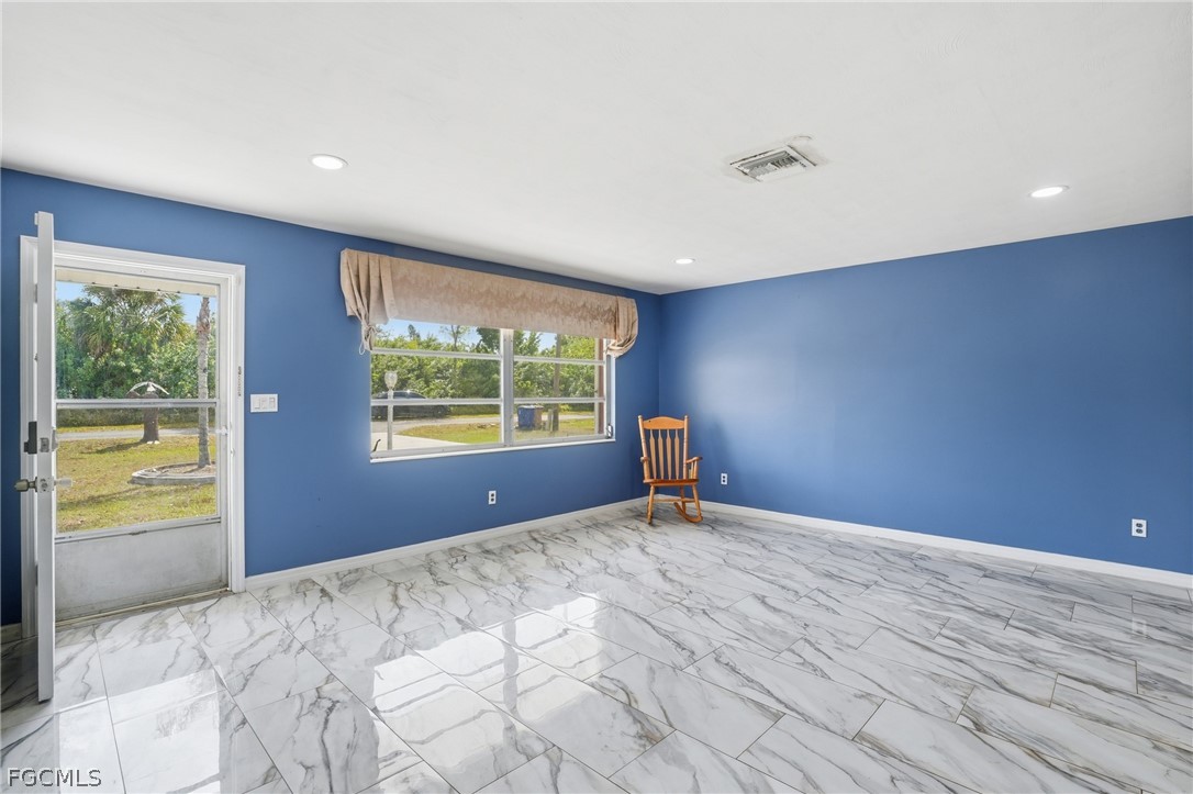 2180 Cook Lane Alva, FL 33920 - Photo 8 of 46 a view of an empty room with a window