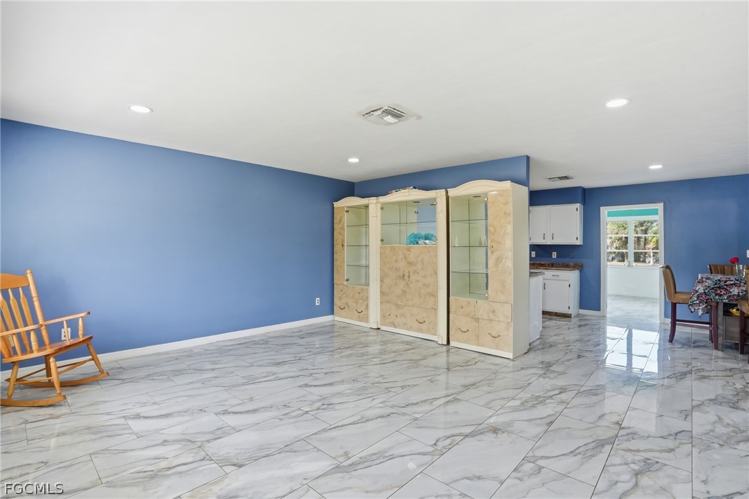 2180 Cook Lane Alva, FL 33920 - Photo 9 of 46 a view of an empty room with furniture and a ceiling fan