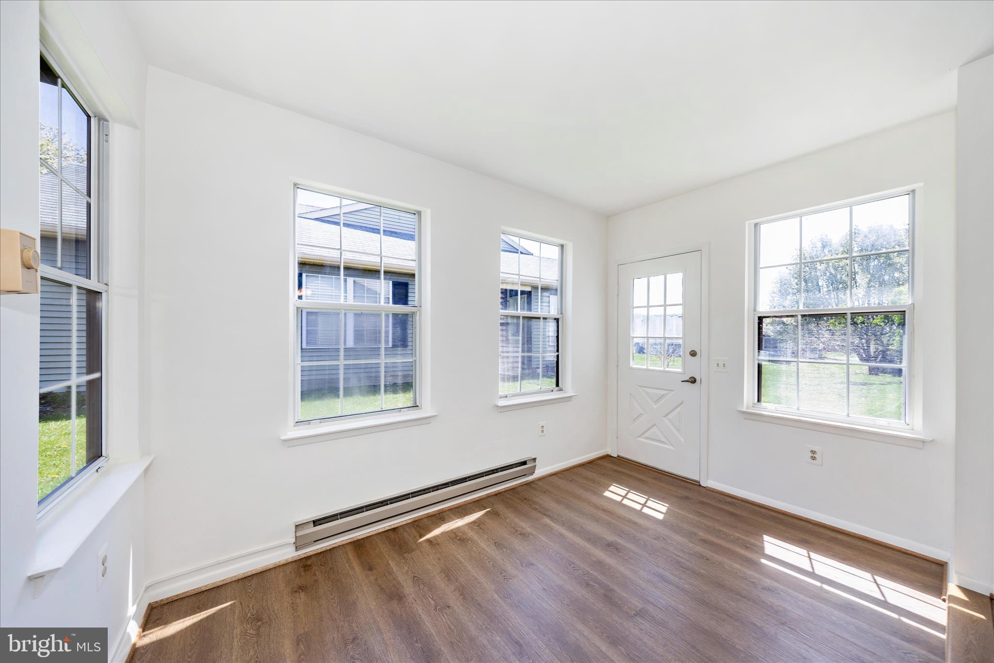 5738 Box Elder Court Frederick, MD 21703 - Photo 11 of 50 a view of empty room with wooden floor and fan