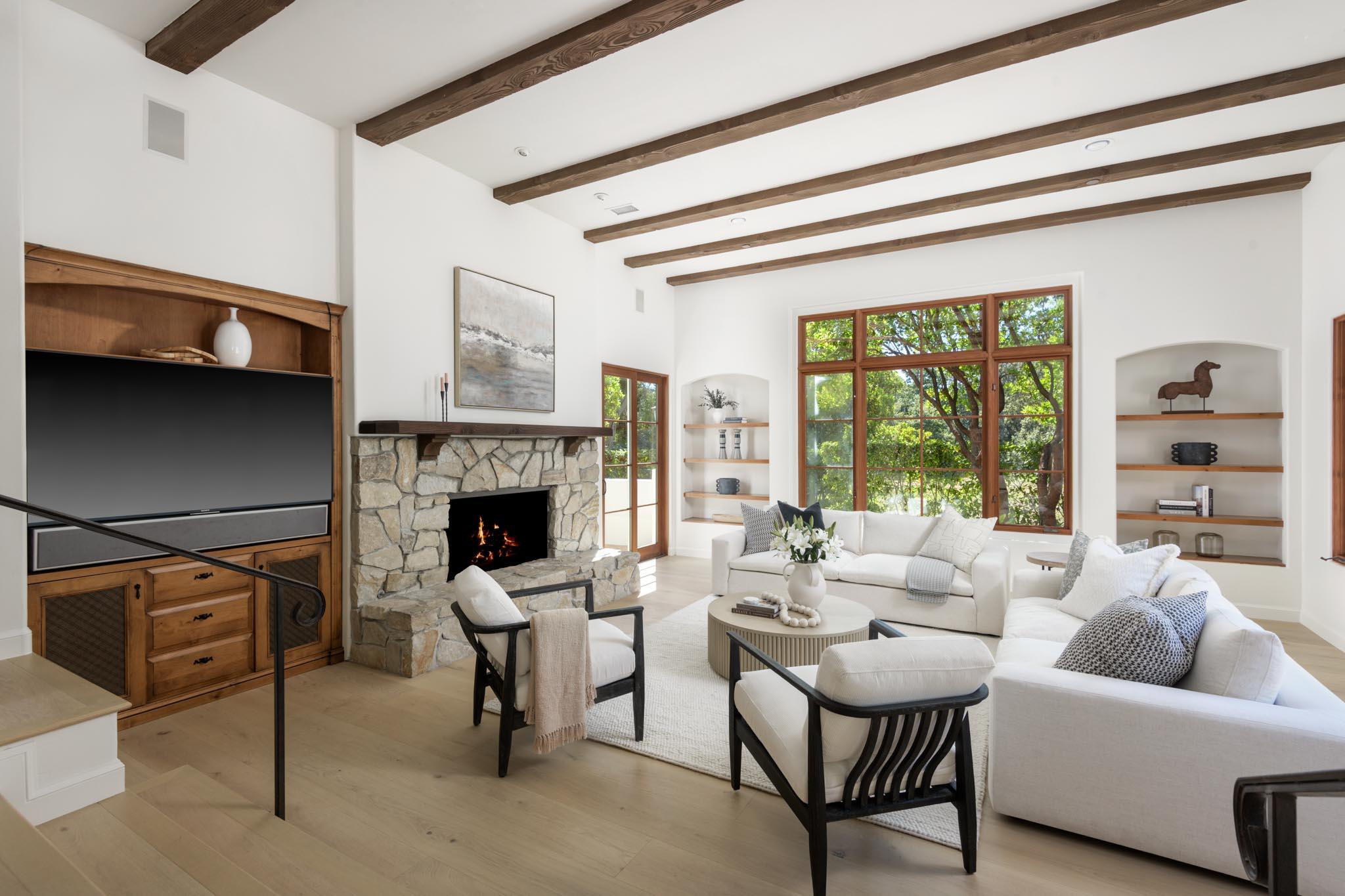 2030 Creekside Road Santa Barbara, CA 93108 - Photo 14 of 41 a living room with furniture and a fireplace