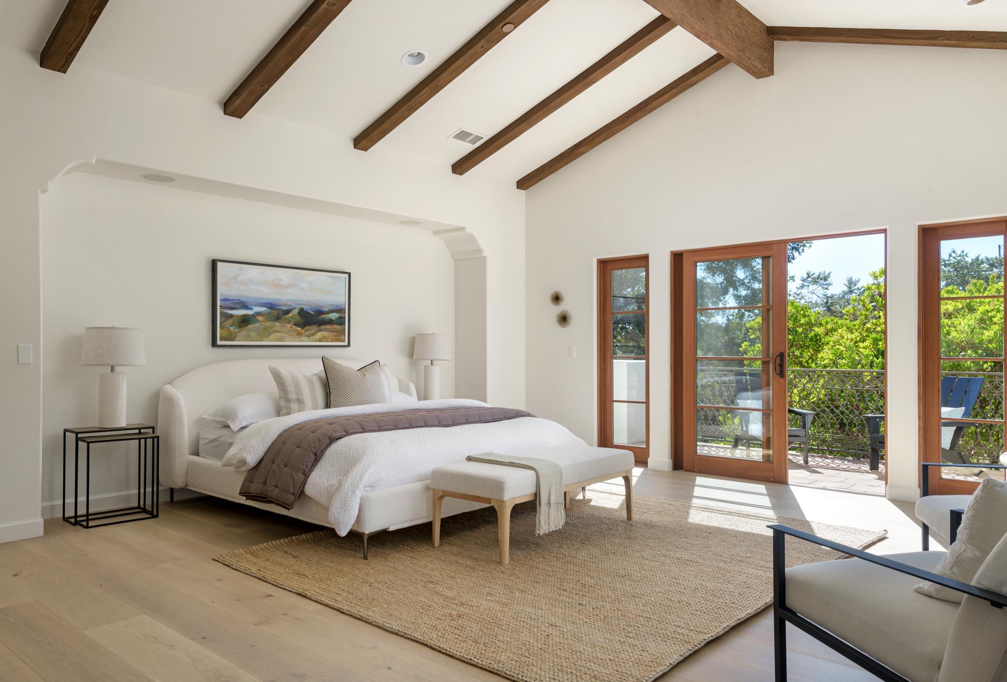 2030 Creekside Road Santa Barbara, CA 93108 - Photo 18 of 41 a bedroom with a bed a balcony and a couch