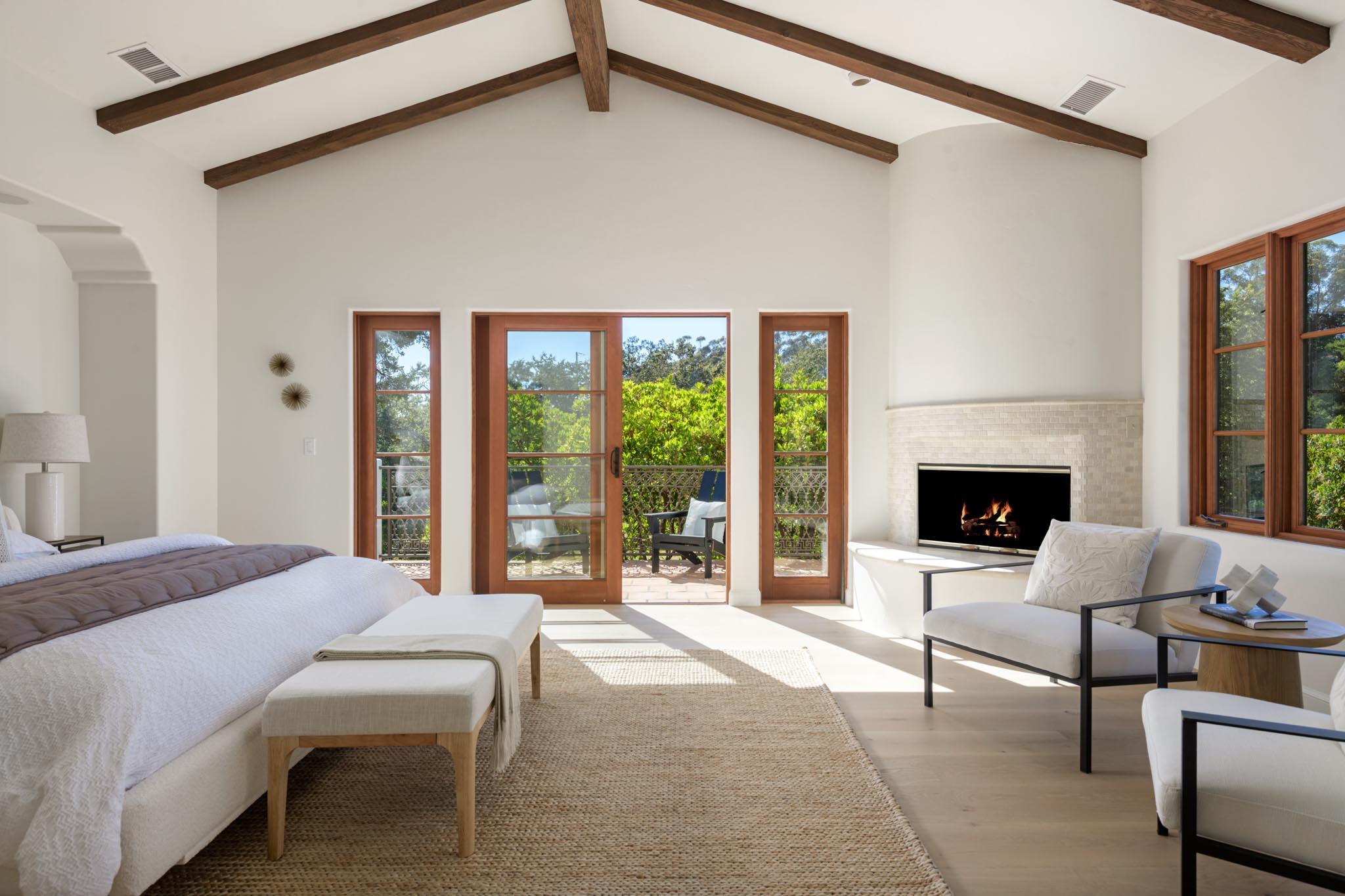 2030 Creekside Road Santa Barbara, CA 93108 - Photo 19 of 41 a bedroom with a bed and a fireplace