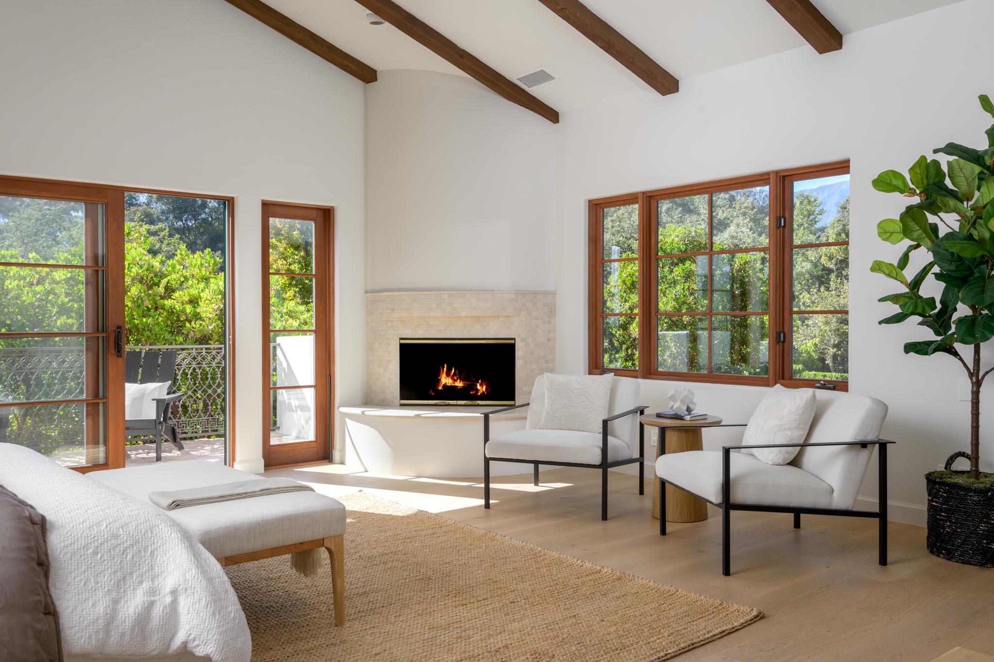 2030 Creekside Road Santa Barbara, CA 93108 - Photo 21 of 41 a bedroom with furniture and a fireplace