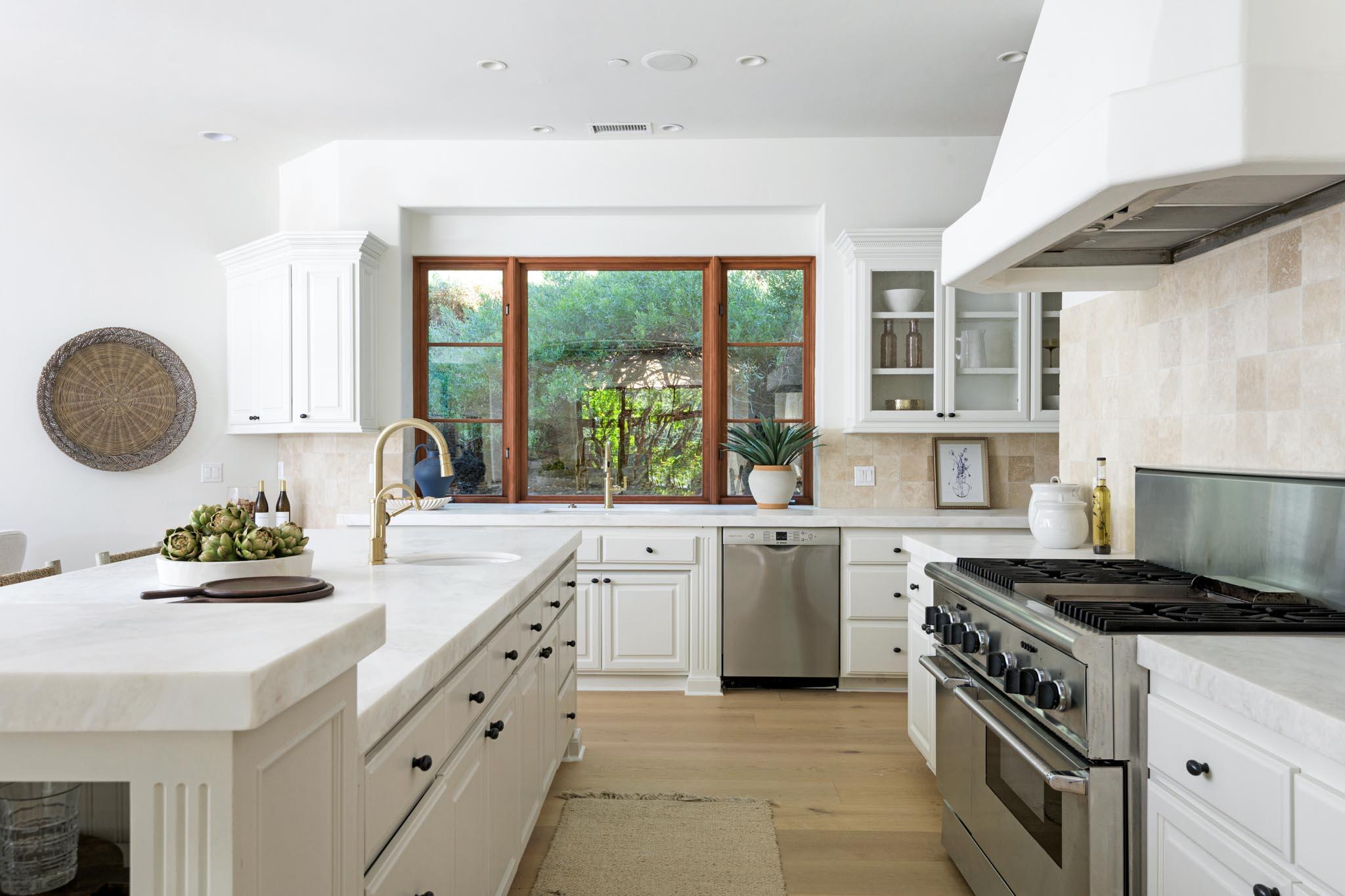 2030 Creekside Road Santa Barbara, CA 93108 - Photo 6 of 41 a kitchen with a sink stove and cabinets