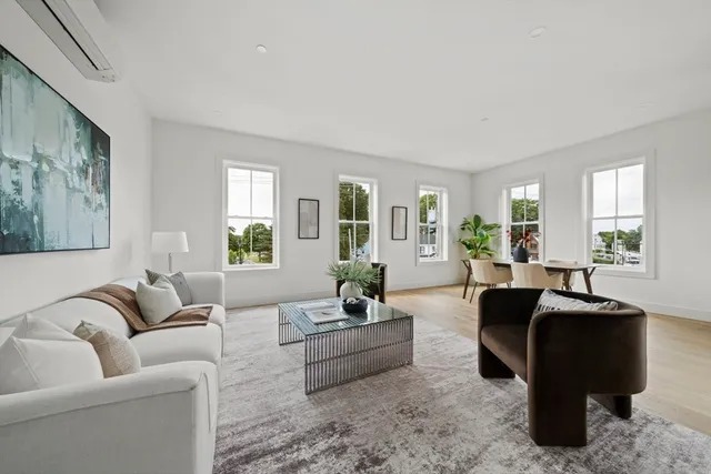 a living room with furniture or couch and a window