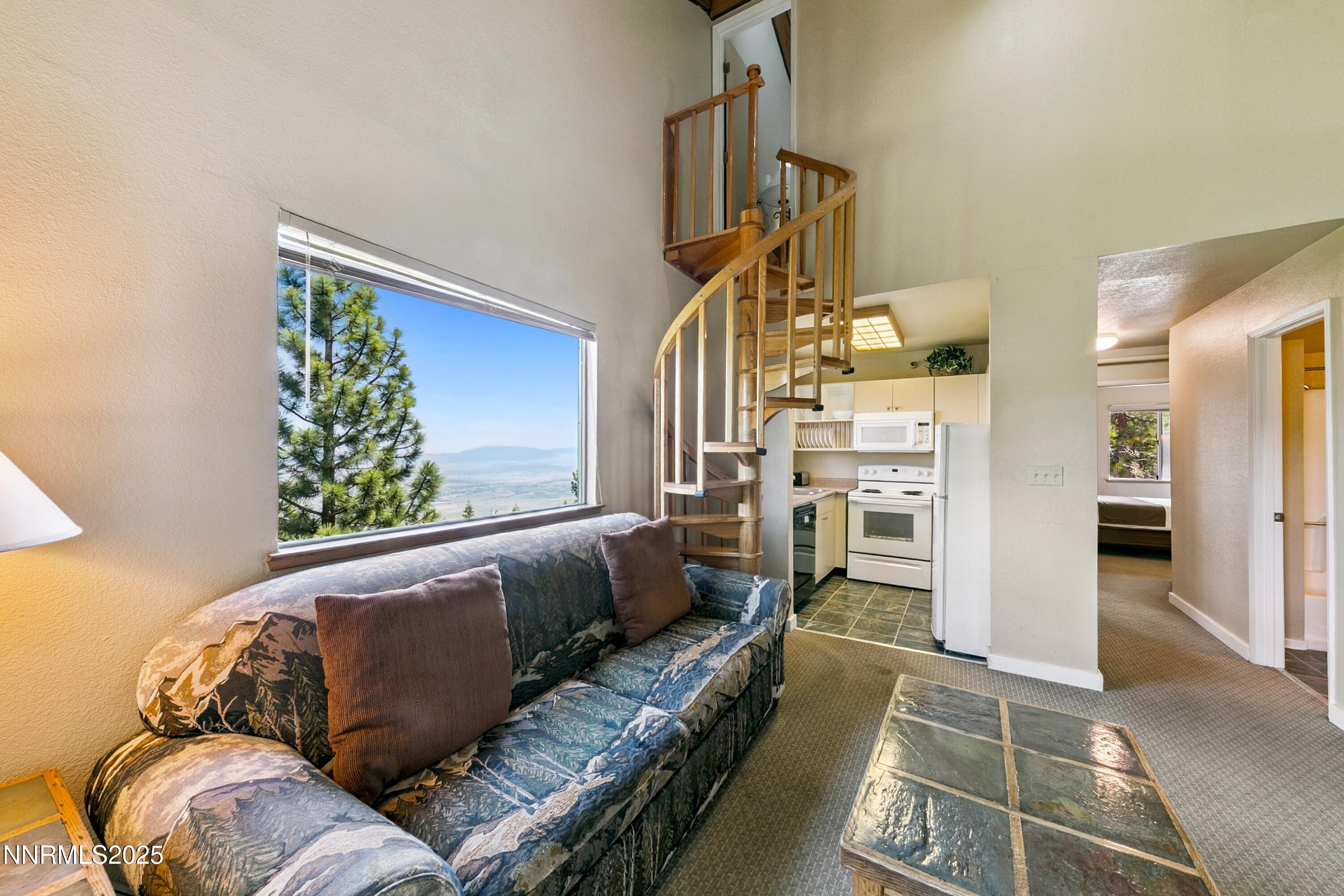 305 Galaxy Lane, Unit 8 Stateline, NV 89449 - Photo 14 of 56 a living room with furniture and a rug