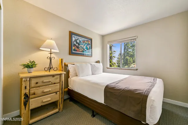 a bathroom with a sink toilet vanity and shower