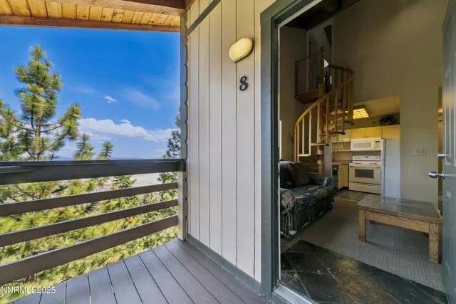 a view of a house with a yard and wooden fence