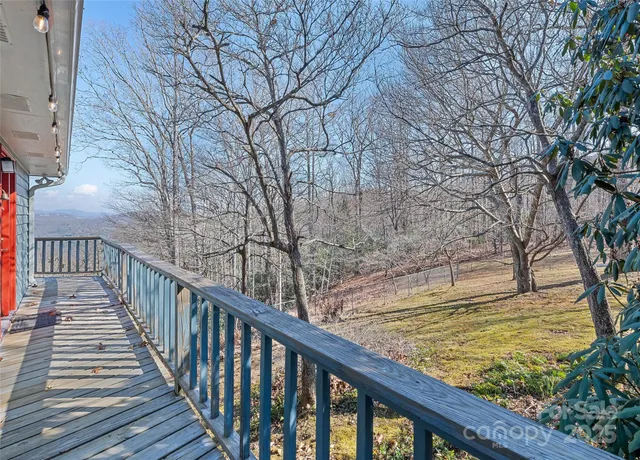 a view of a wooden deck with a trees