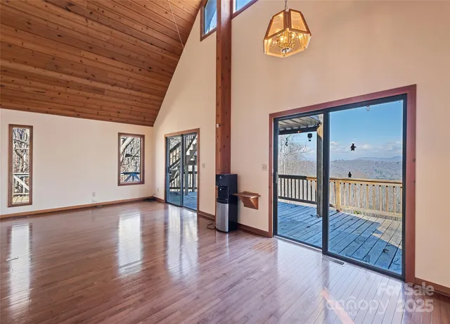 a view of an entryway with wooden floor
