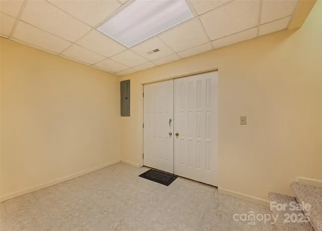 a view of a room with wooden walls