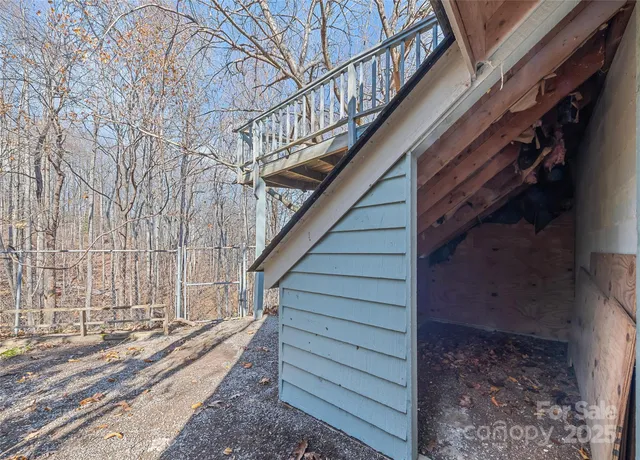 a view of a balcony with wooden floor