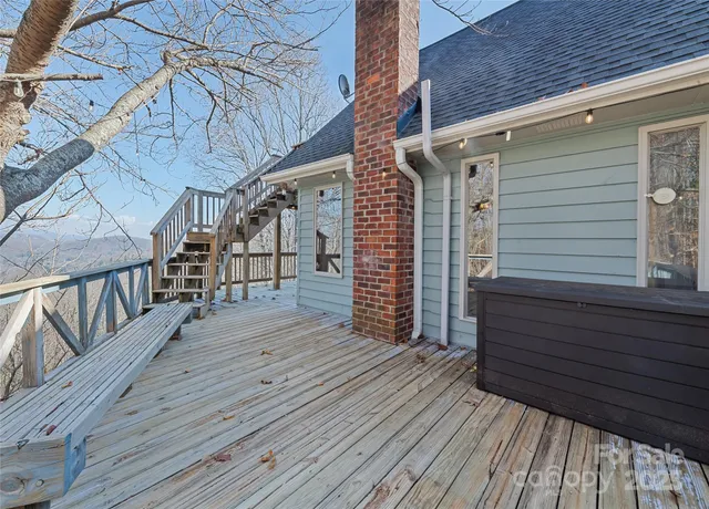 a view of outdoor space and deck with patio