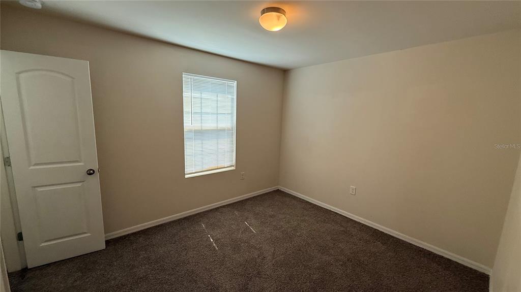 3616 Marshall Road North Port, FL 34288 - Photo 9 of 15 an empty room with a window