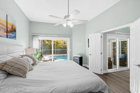 a bedroom with a large bed and a window