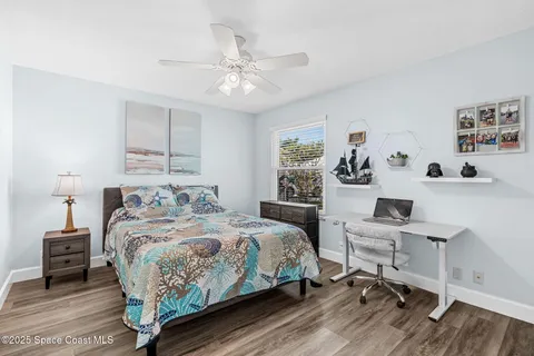 a bedroom with a bed and a table in it