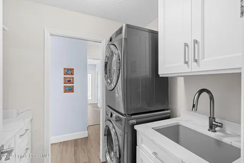 a view of a backyard with swimming pool