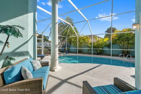 a patio with a table and chairs